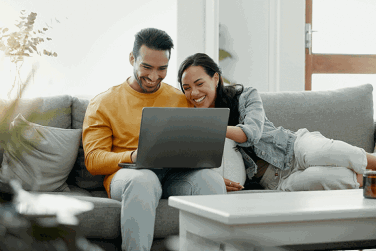 Couple using laptop